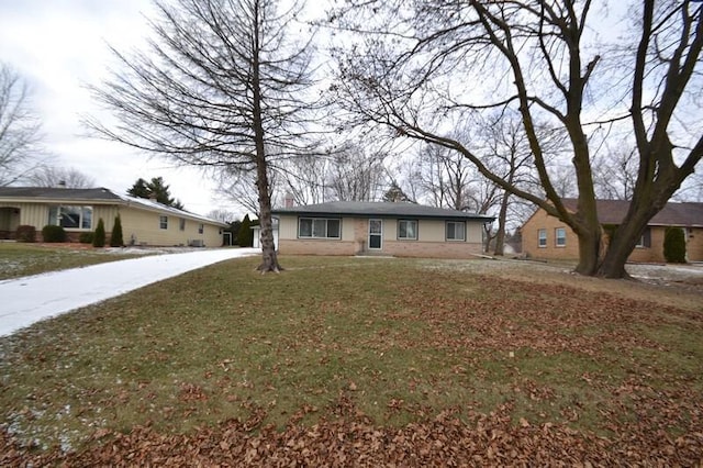 ranch-style home with a front lawn