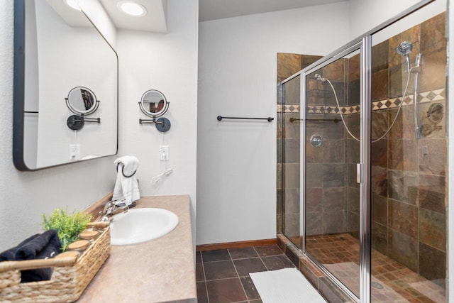 bathroom featuring vanity, tile patterned flooring, and an enclosed shower