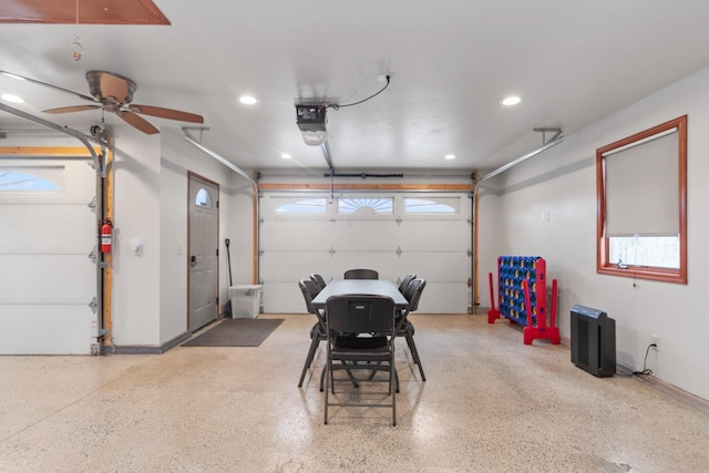 garage featuring ceiling fan and a garage door opener