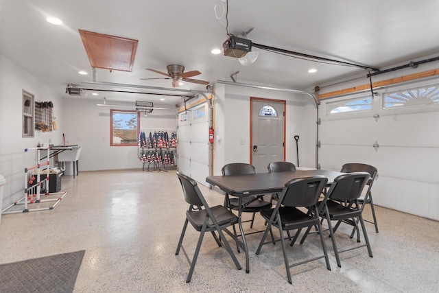 interior space featuring ceiling fan and a garage door opener