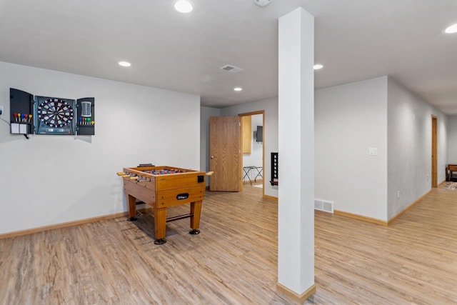 recreation room with light wood-type flooring