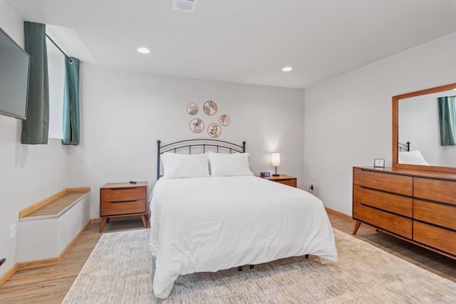 bedroom with wood-type flooring