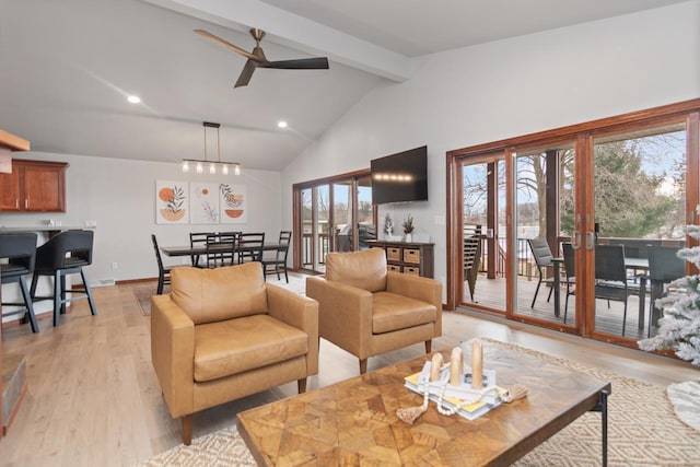 living room featuring ceiling fan, light hardwood / wood-style floors, beam ceiling, high vaulted ceiling, and french doors