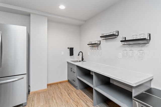 interior space with hardwood / wood-style floors and sink