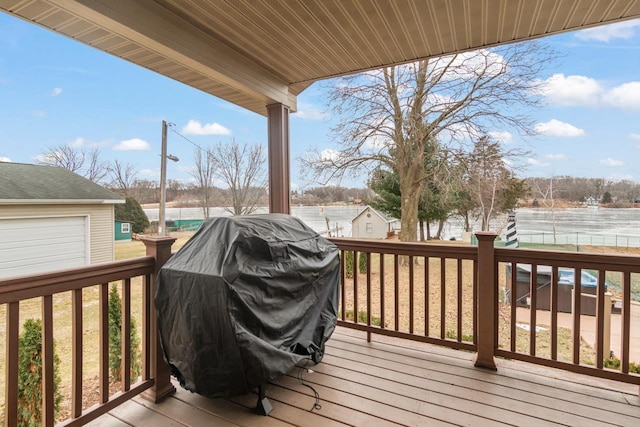 wooden terrace featuring grilling area