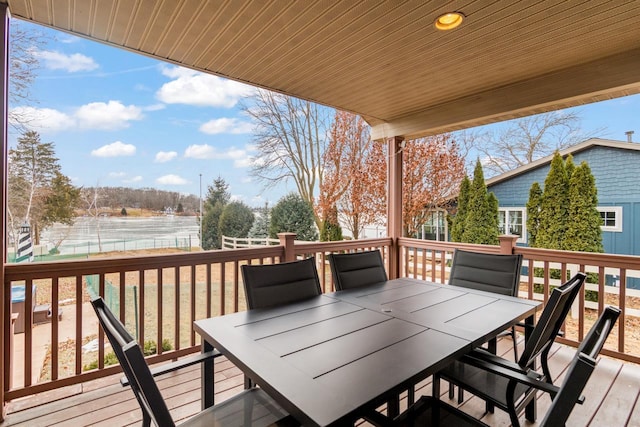 wooden deck featuring a water view