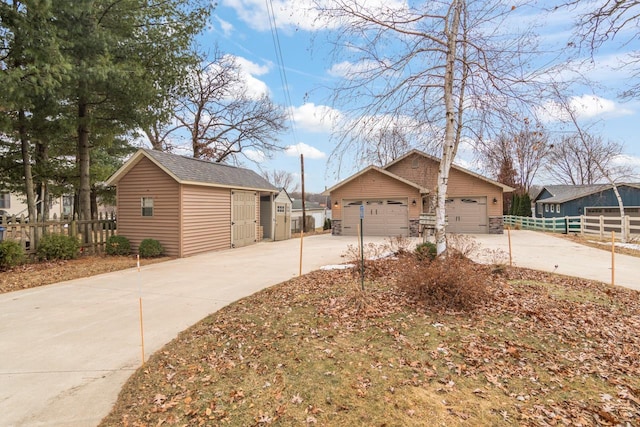 view of home's exterior featuring a garage and an outdoor structure