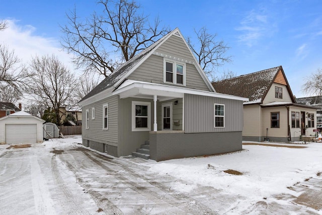 view of front facade featuring a garage and a storage unit