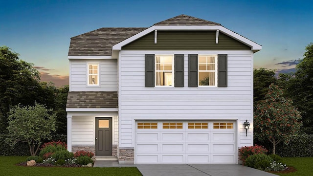 view of front of property with a garage