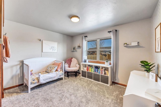 sitting room featuring light colored carpet