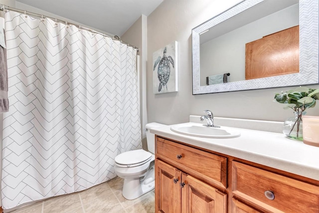 bathroom with toilet, tile patterned flooring, walk in shower, and vanity