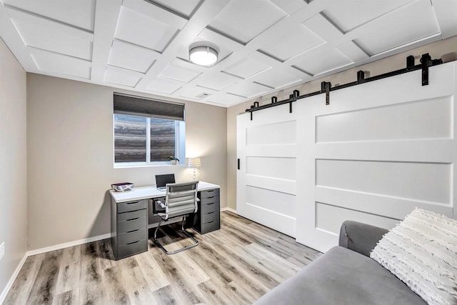 office with coffered ceiling and light hardwood / wood-style flooring