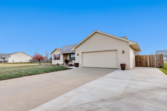 ranch-style house featuring a front lawn and a garage