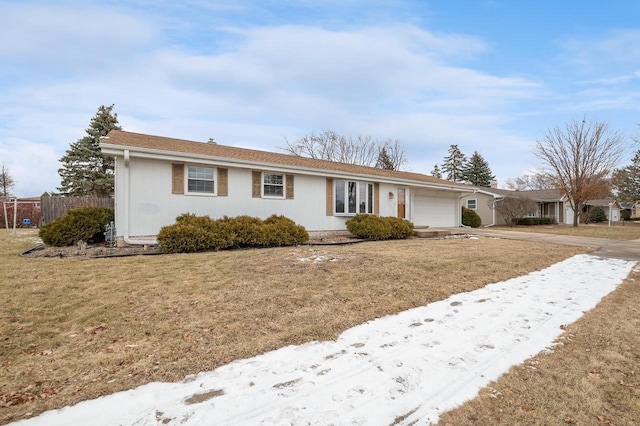 single story home with a front lawn and a garage