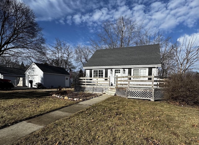 view of front of home featuring a front lawn and a deck