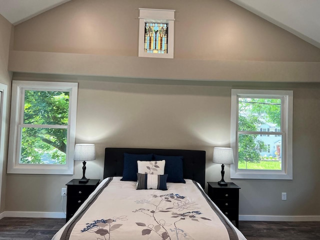 bedroom featuring dark wood-type flooring and vaulted ceiling