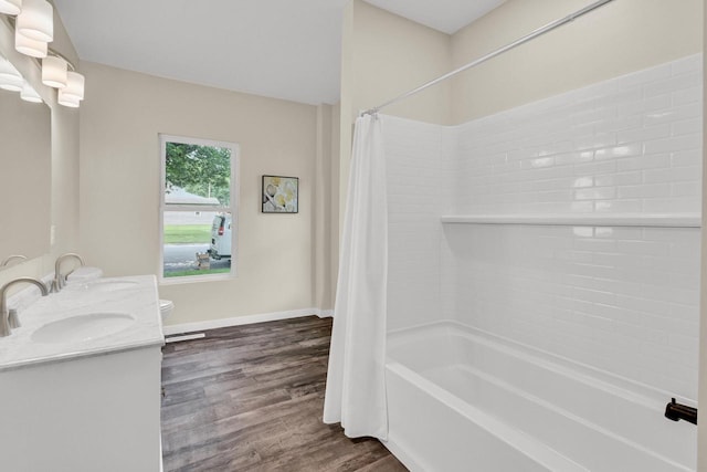 full bathroom featuring toilet, vanity, wood-type flooring, and shower / tub combo with curtain