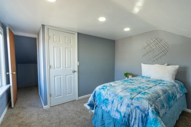 carpeted bedroom featuring vaulted ceiling