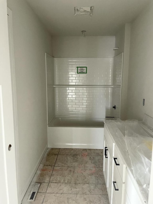 bathroom featuring vanity and shower / bath combination