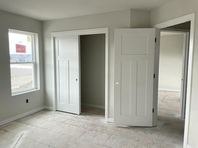 unfurnished bedroom featuring a closet