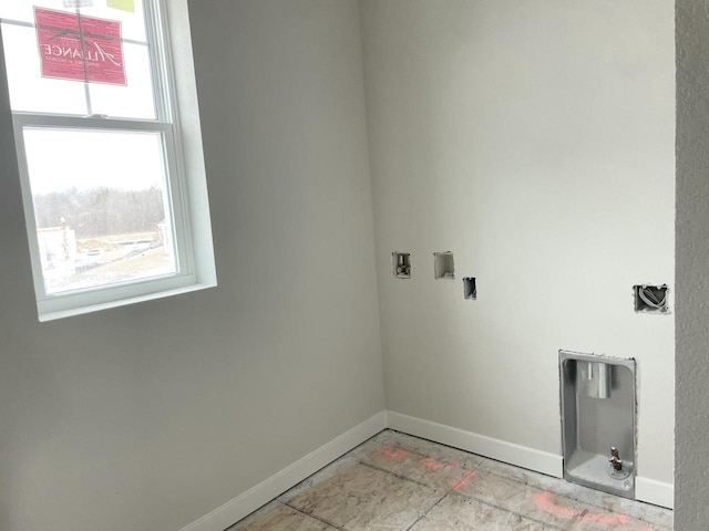 clothes washing area featuring washer hookup