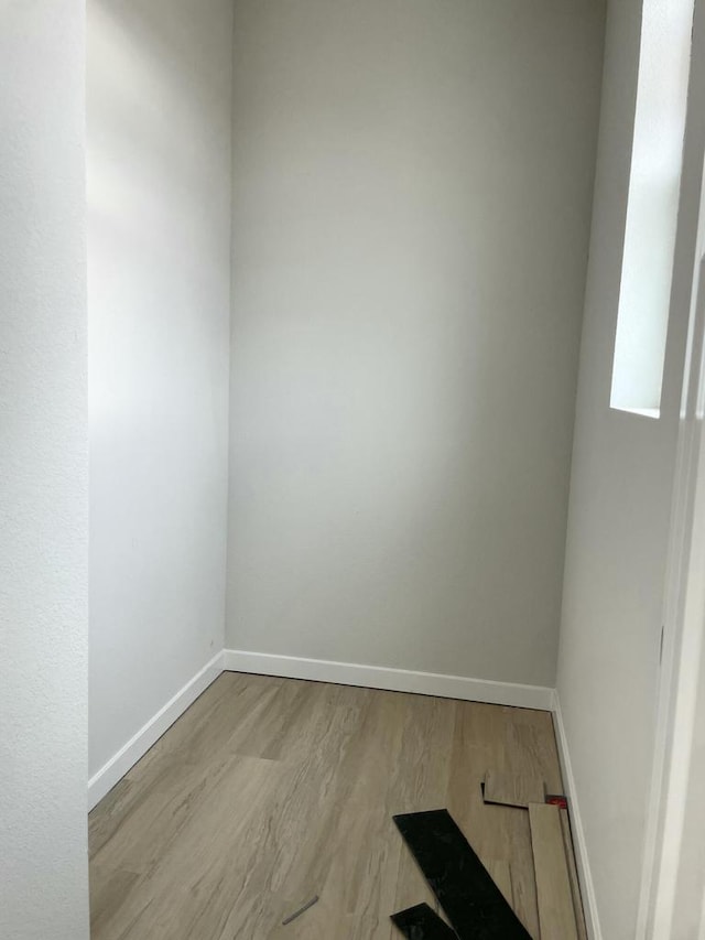 empty room with light hardwood / wood-style flooring