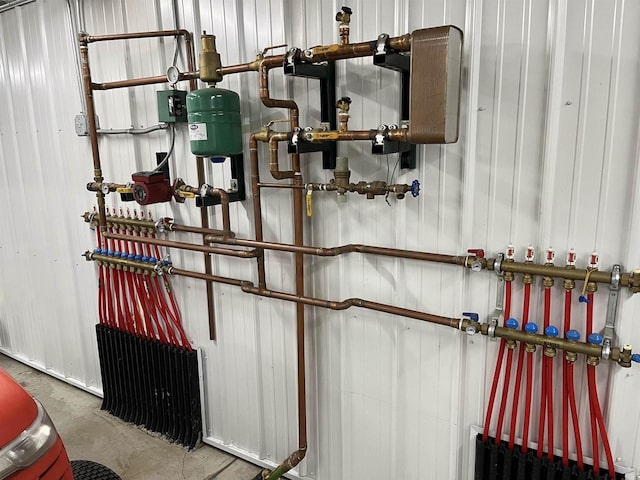 utility room featuring radiator heating unit