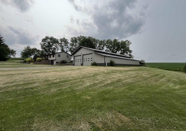 view of yard featuring a garage