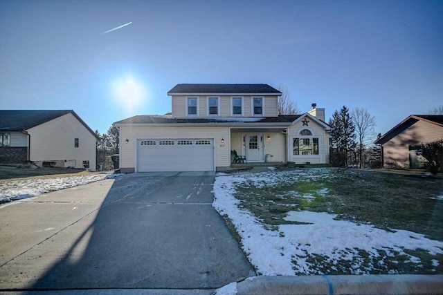 view of front of property with a garage and covered porch