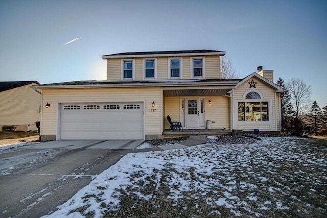 view of front property featuring a garage and a porch