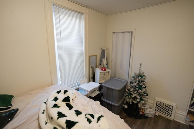 bedroom with wood-type flooring