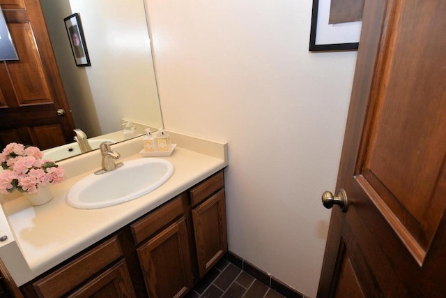 bathroom with tile patterned floors and vanity