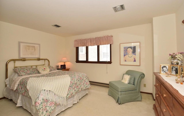 bedroom featuring baseboard heating and light colored carpet