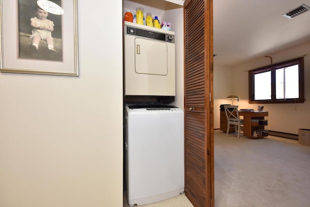 laundry room featuring light colored carpet and stacked washer and clothes dryer