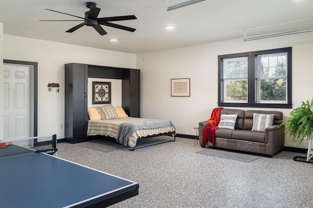 bedroom with ceiling fan and carpet flooring