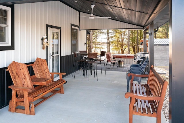 view of patio / terrace featuring ceiling fan and a hot tub