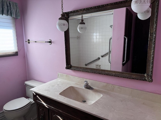 bathroom featuring toilet and vanity