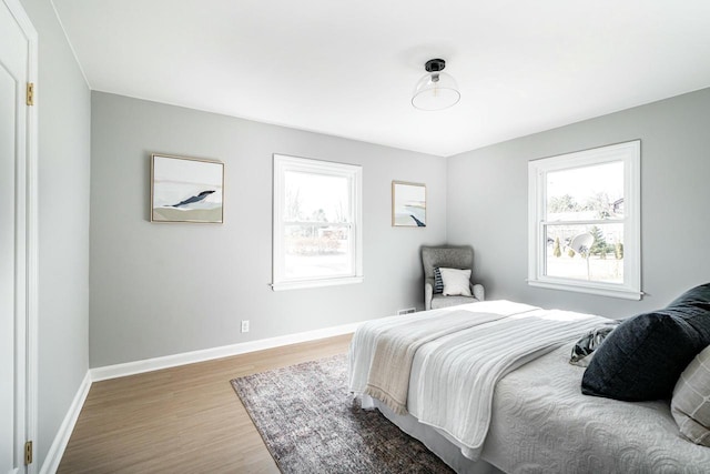 bedroom with hardwood / wood-style flooring