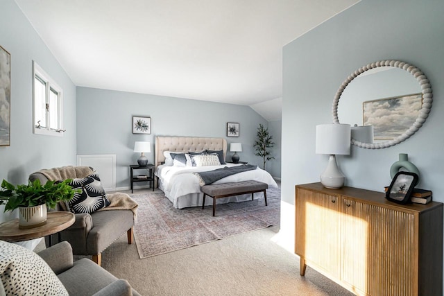 carpeted bedroom featuring lofted ceiling