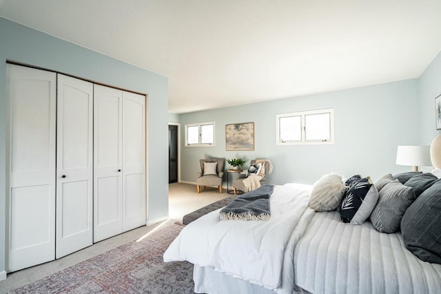 carpeted bedroom with a closet