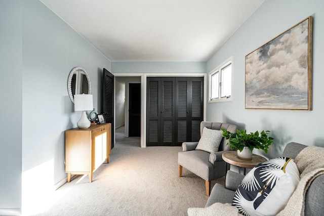 living area featuring light colored carpet