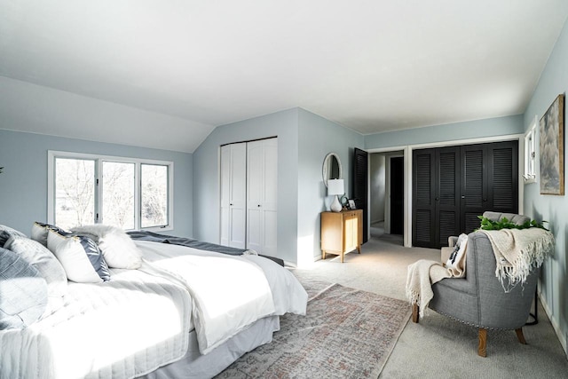 carpeted bedroom featuring vaulted ceiling