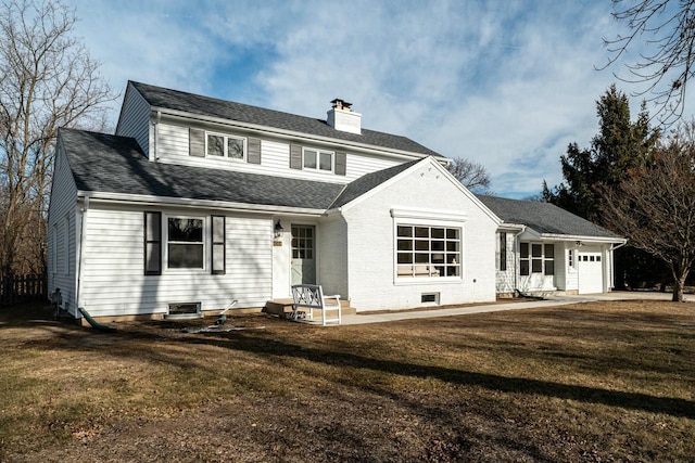 view of front of home with a garage and a front yard