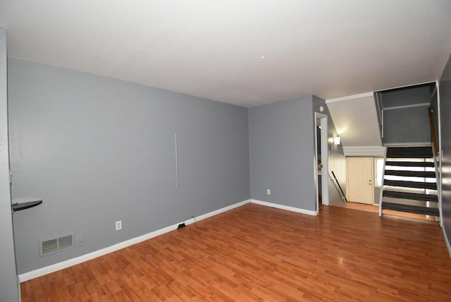 unfurnished room featuring hardwood / wood-style flooring