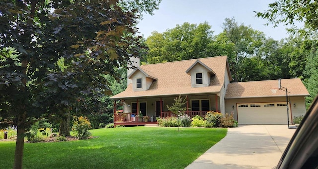 new england style home with a garage, a front lawn, and a porch