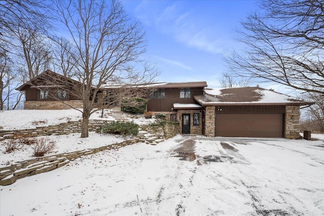 N1535 Rabes Hilltop Rd, New Holstein, WI 53061 - view of front of home featuring stone siding and a garage