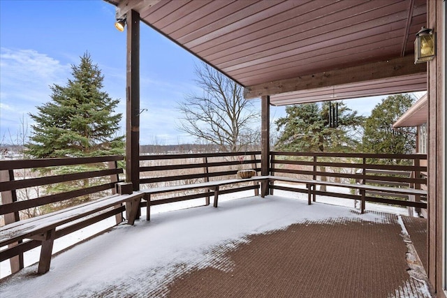 view of snow covered deck