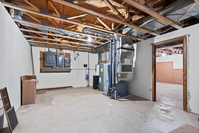 basement with heating unit and electric panel