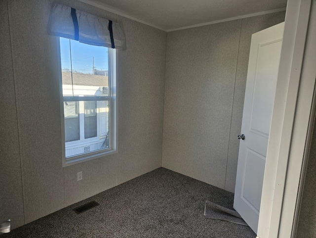 carpeted empty room with ornamental molding