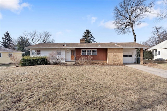 ranch-style house featuring a garage, a front yard, and a carport